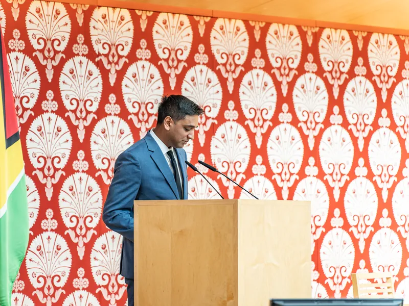 A speaker addresses the business forum